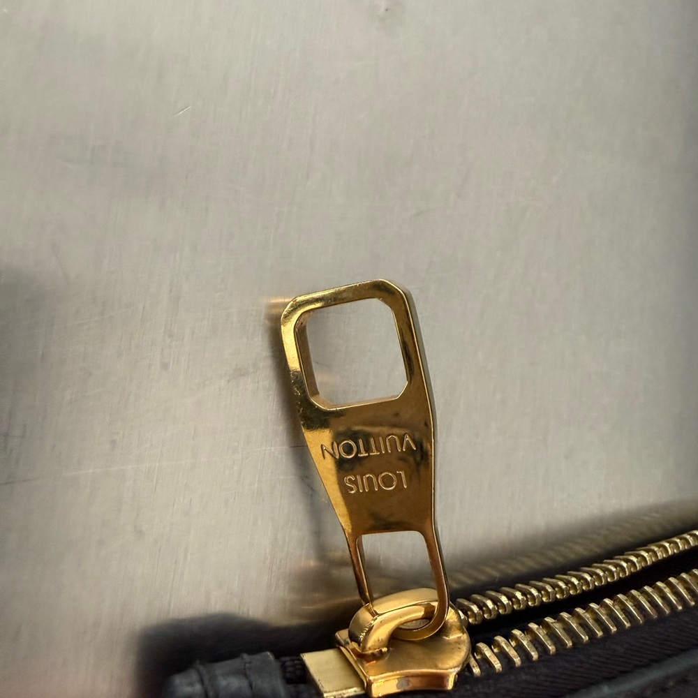 Louis Vuitton Black Wristlet with Gold Accents - Picture 4 of 6